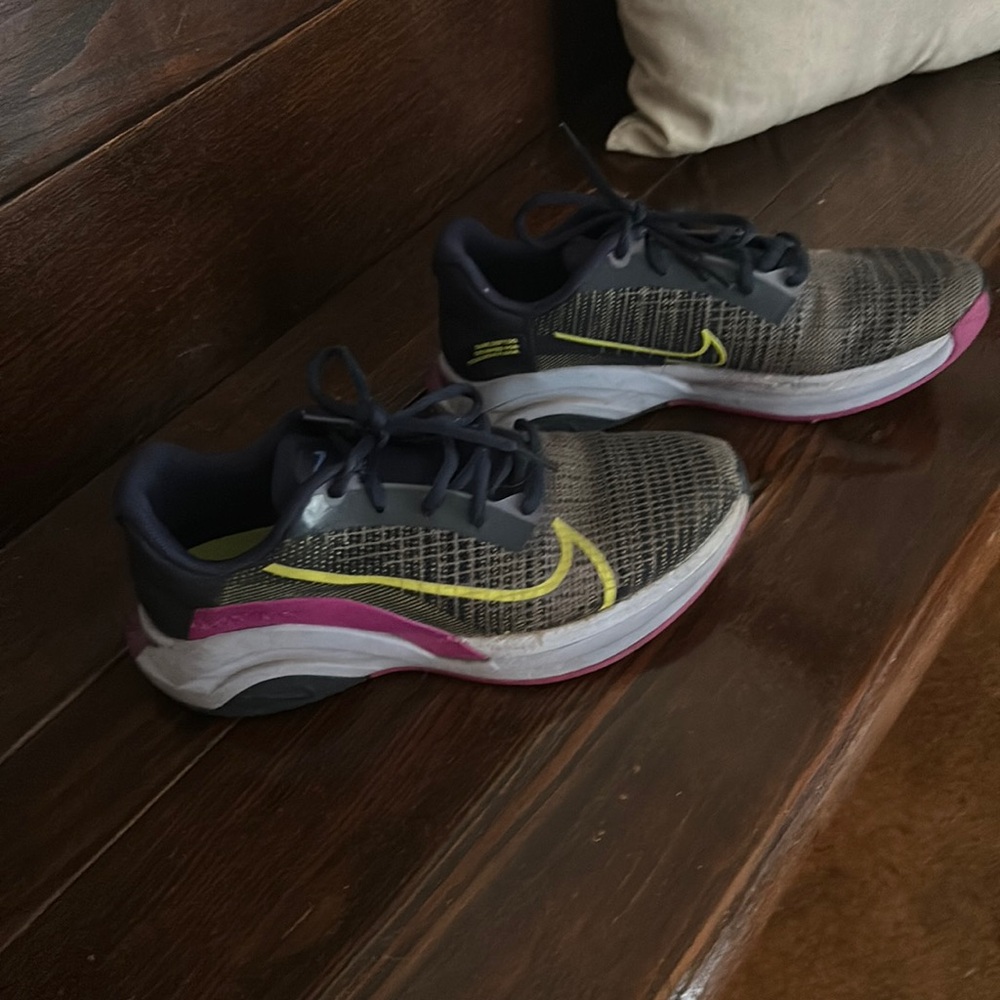 Nike superego athletic shoes. Navy blue, purple and lime green undertones.